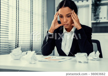 A competent female employee who has become completely exhausted from overwork. A competent female employee who has become completely exhausted from overwork. 98063662