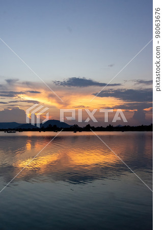 lake of chapala, jalisco mexico, lake at sunset with fishing boats, sun reflection on the lake, mexico lake of chapala, jalisco mexico, lake at sunset with fishing boats, sun reflection on the lake, mexico 98063676