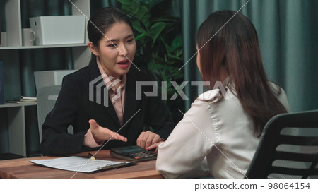 Young enthusiastic businesswoman negotiate financial business contract. Young enthusiastic businesswoman negotiate financial business contract. 98064154