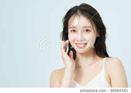 Beauty image of a young woman with glossy skin Beauty image of a young woman with glossy skin 98064383