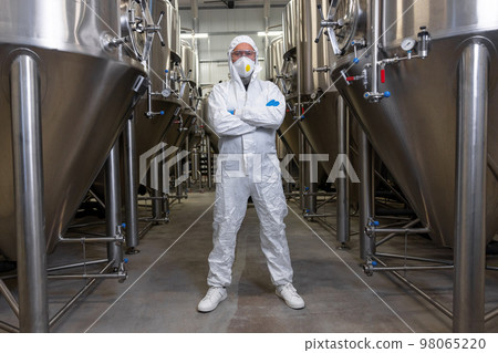 Brewer posing for the camera at the beer plant Brewer posing for the camera at the beer plant 98065220