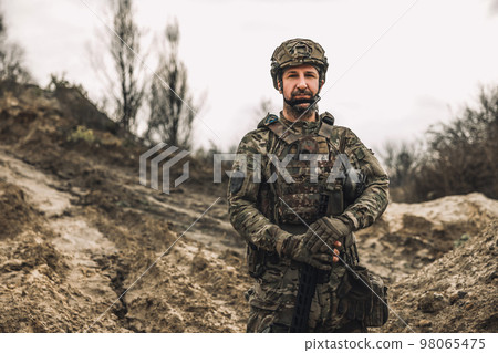 A soldier standing in a dig-position A soldier standing in a dig-position 98065475