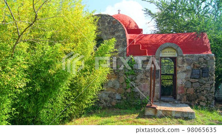 small house in the middle of the countryside, stone house, with tile roof, around cactus, flowers and vegetation, small house in the middle of the countryside, stone house, with tile roof, around cactus, flowers and vegetation, 98065635