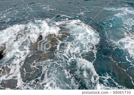 Top view of the turquoise water with rocks. Top view of the turquoise water with rocks. 98065730