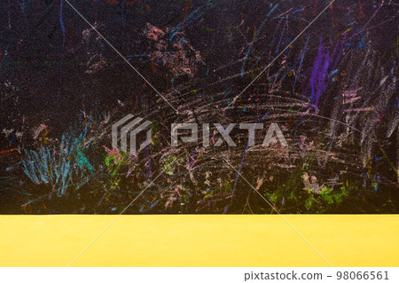 Abstract background - black board painted with colored pencils and yellow table Abstract background - black board painted with colored pencils and yellow table 98066561