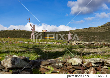 Mountains. Green mountains in the municipality of El Atazar, north of the Community of Madrid. Sunny day with air and clouds decorating the sky. Iron decoration on the green grass. Farmer. Donkey. Mountains. Green mountains in the municipality of El Atazar, north of the Community of Madrid. Sunny day with air and clouds decorating the sky. Iron decoration on the green grass. Farmer. Donkey. 98066681