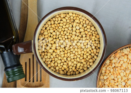 Soy in bowl. Protein pulse that is dried and then soaked and cooked before eating. Vegetarian organic product. Top view. 98067113