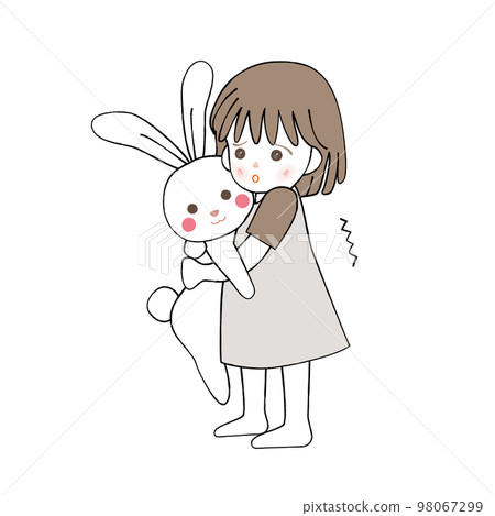 A frightened girl holding a stuffed rabbit 98067299