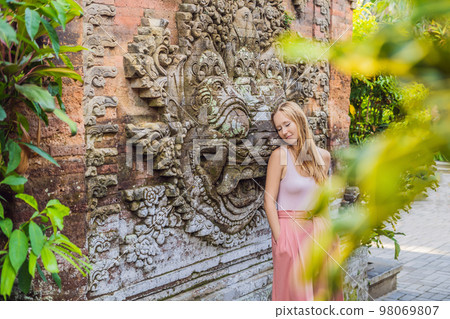Young woman traveler in Ubud palace, Bali - Inside the Ubud palace, Bali, Indonesia 98069807