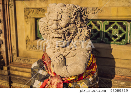 Stone balinese mossy statue Bali island Indonesia Stone balinese mossy statue Bali island Indonesia 98069819