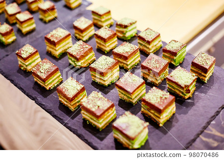 Square pieces of pastries Square pieces of pastries 98070486