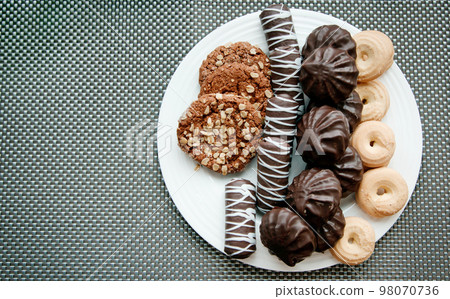 Cookies on a plate. 98070736