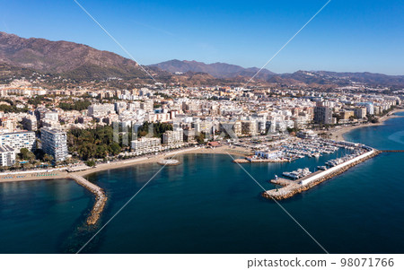 Aerial drone perspective of beautiful over luxury Puerto Banus Bay in Marbella. Spain Aerial drone perspective of beautiful over luxury Puerto Banus Bay in Marbella. Spain 98071766