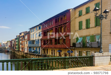Canal in middle of buildings in Castres, France Canal in middle of buildings in Castres, France 98071798