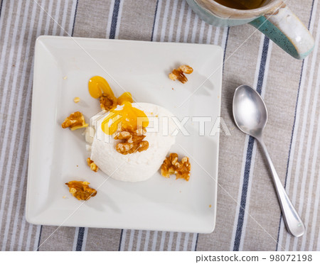 Fresh cottage cheese with honey and walnuts Fresh cottage cheese with honey and walnuts 98072198