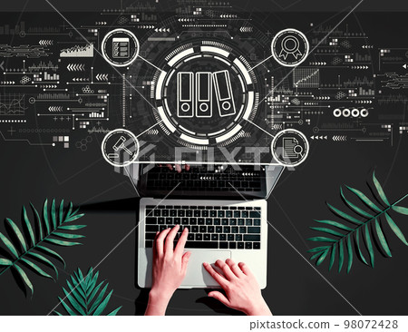 Compliance theme with person using a laptop 98072428