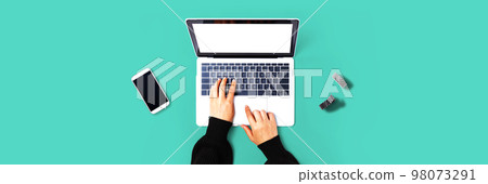 Person using a laptop computer Person using a laptop computer 98073291