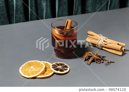Christmas drink Vin Chaud, French mulled wine ingredients_cinnamon and dried fruits 98074128