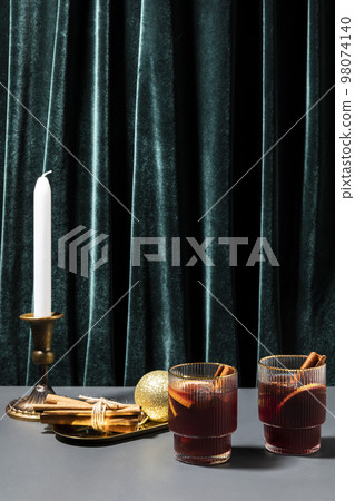 Christmas drink Vin Chaud, French mulled wine ingredients_cinnamon and dried fruits 98074140