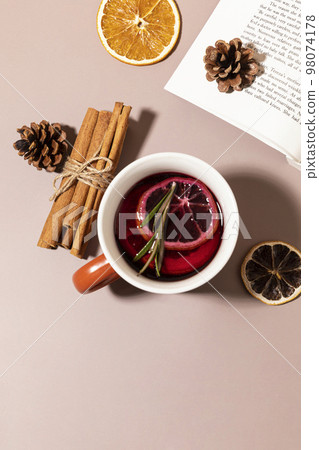 Christmas drink Vin Chaud, French mulled wine ingredients_cinnamon and dried fruits Christmas drink Vin Chaud, French mulled wine ingredients_cinnamon and dried fruits 98074178