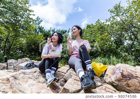 korean young women hiking and plogging_eating water and lunch box korean young women hiking and plogging_eating water and lunch box 98074586