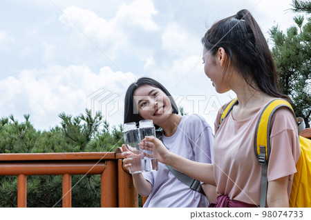 korean young women hiking and plogging_drinking water korean young women hiking and plogging_drinking water 98074733