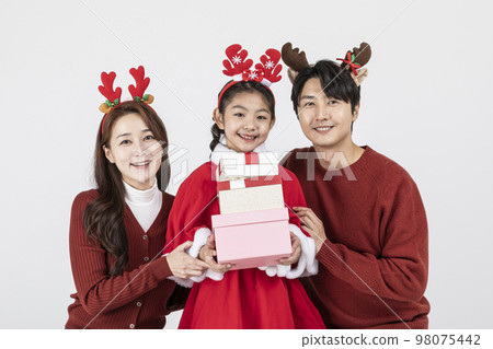 happy Asian Korean family in Christmas concept_holding a gift box 98075442