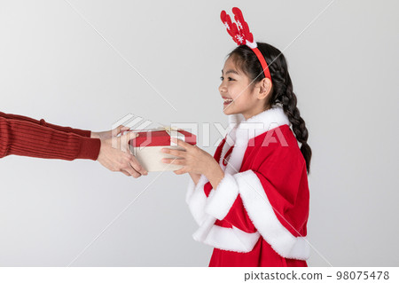 happy Asian Korean family in Christmas concept_giving, receiving gifts 98075478