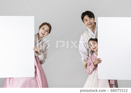 Korean family in Hanbok, isolated white background_holding a panel 98075522