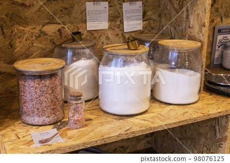 eco friendly habits hand gesture_powder detergent refill station view 98076125