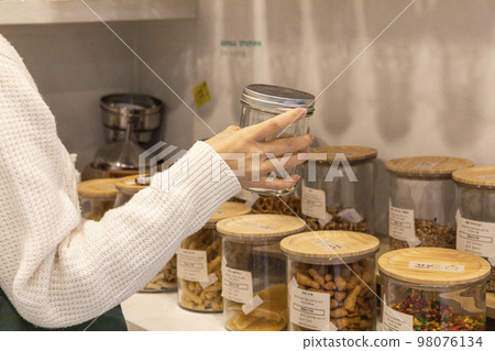 eco friendly habits hand gesture_refill station with empty bottle eco friendly habits hand gesture_refill station with empty bottle 98076134