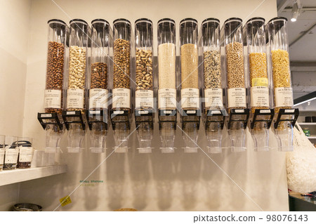 eco friendly habits hand gesture_nuts refill in zero waste shop 98076143