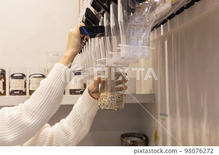eco friendly habits hand gesture_refill of mixed grain rice eco friendly habits hand gesture_refill of mixed grain rice 98076272