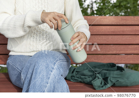 eco friendly habits hand gesture_using tumbler eco friendly habits hand gesture_using tumbler 98076770