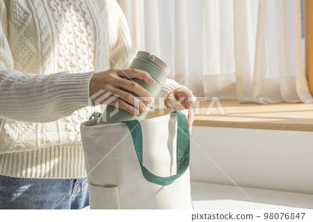 eco friendly habits hand gesture_tumbler and eco bag eco friendly habits hand gesture_tumbler and eco bag 98076847