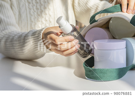 eco friendly habits hand gesture_empty bottle in the eco bag eco friendly habits hand gesture_empty bottle in the eco bag 98076881