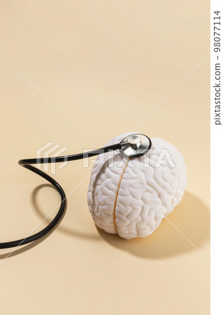 brain health and dementia series_examine a brain miniature brain health and dementia series_examine a brain miniature 98077114