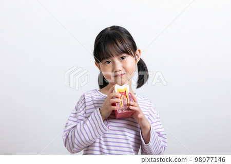 Asian Korean child with tooth miniature Asian Korean child with tooth miniature 98077146