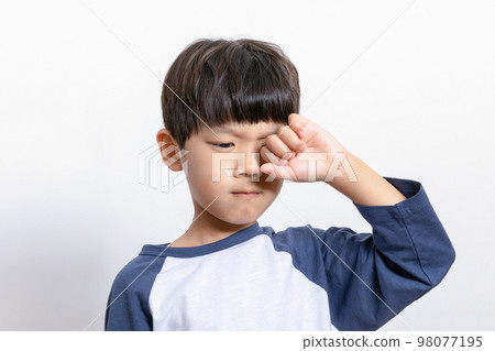 Asian Korean child rubbing his eyes Asian Korean child rubbing his eyes 98077195