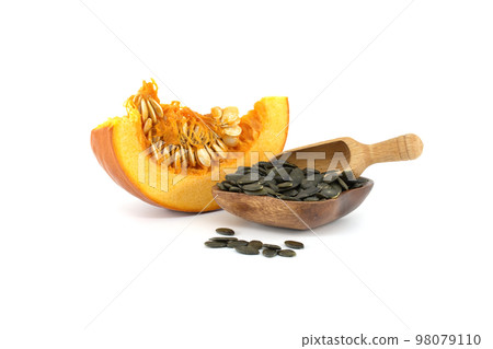 Pumpkin seeds and fresh pumpkin slice isolated on white 98079110