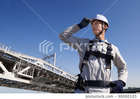 Male worker wearing full harness Work at height Construction site image 98080183