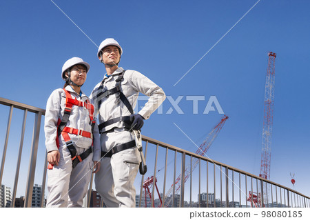 Worker wearing full harness Work at height Construction site Image 98080185