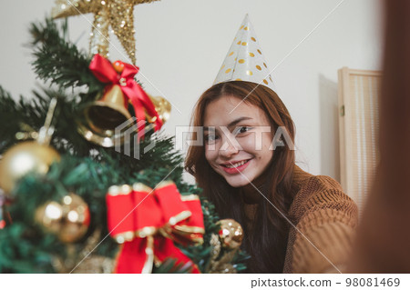 Cheerful lady surprised of the present after the opening in the gift box. Marry Christmas and Happy Holidays and New Year eve celebrating concept Cheerful lady surprised of the present after the opening in the gift box. Marry Christmas and Happy Holidays and New Year eve celebrating concept 98081469