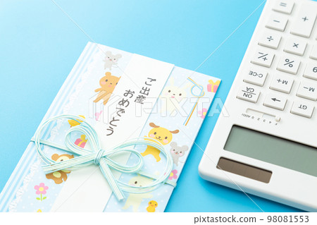 Gift envelope and calculator light blue background 98081553