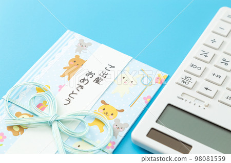 Gift envelope and calculator light blue background 98081559