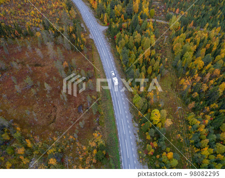 drone footgage Car Camping Caravan driving road lake Swedish Lapland fall ruska colors National Park Sweden 98082295