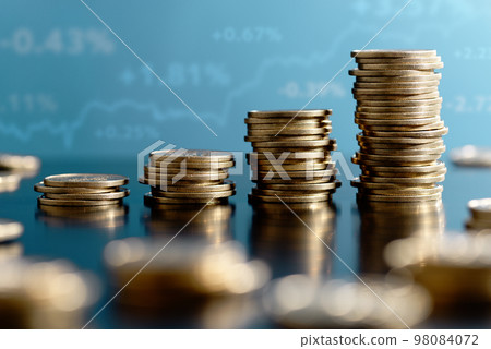 Image of investment and investment yield. Stacked coins and graphs. 98084072