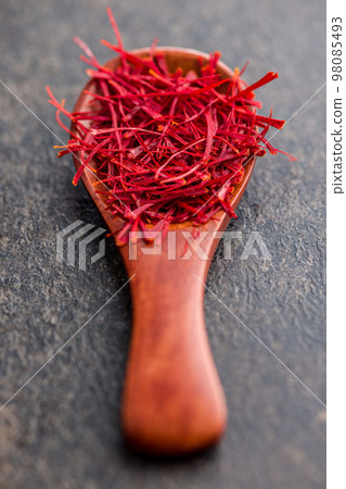 Dried saffron spice in spoon. Dried saffron spice in spoon. 98085493