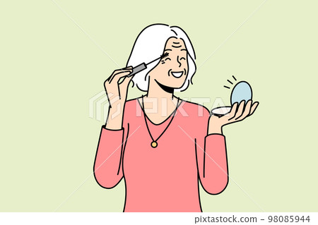 Happy old woman doing makeup 98085944