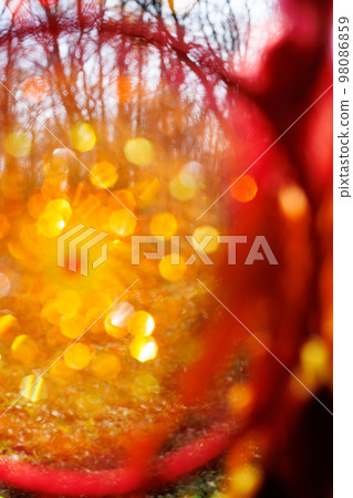 Blurred image, dream catcher native american in the wind with sunlight and blurred bokeh Blurred image, dream catcher native american in the wind with sunlight and blurred bokeh 98086859
